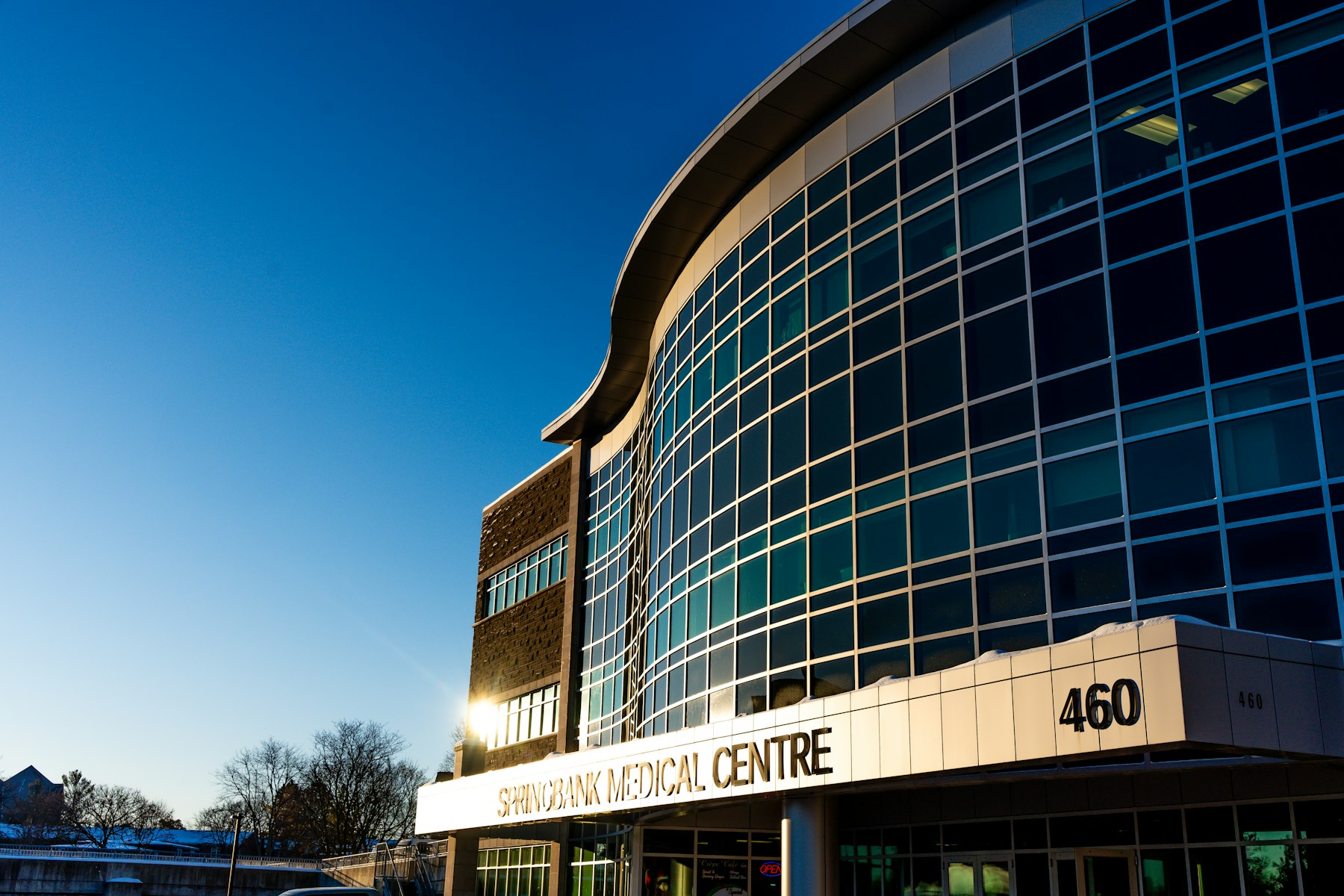 Glass commercial building facade with dark premium architectural finish